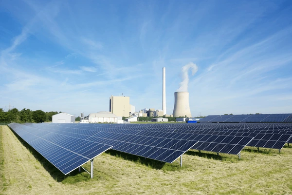 South Africa coal factory emitting smoke and solar panel